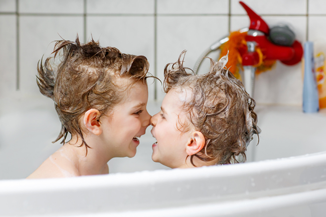 Happy,Siblings:,Two,Little,Twins,Children,Playing,Together,With,Water